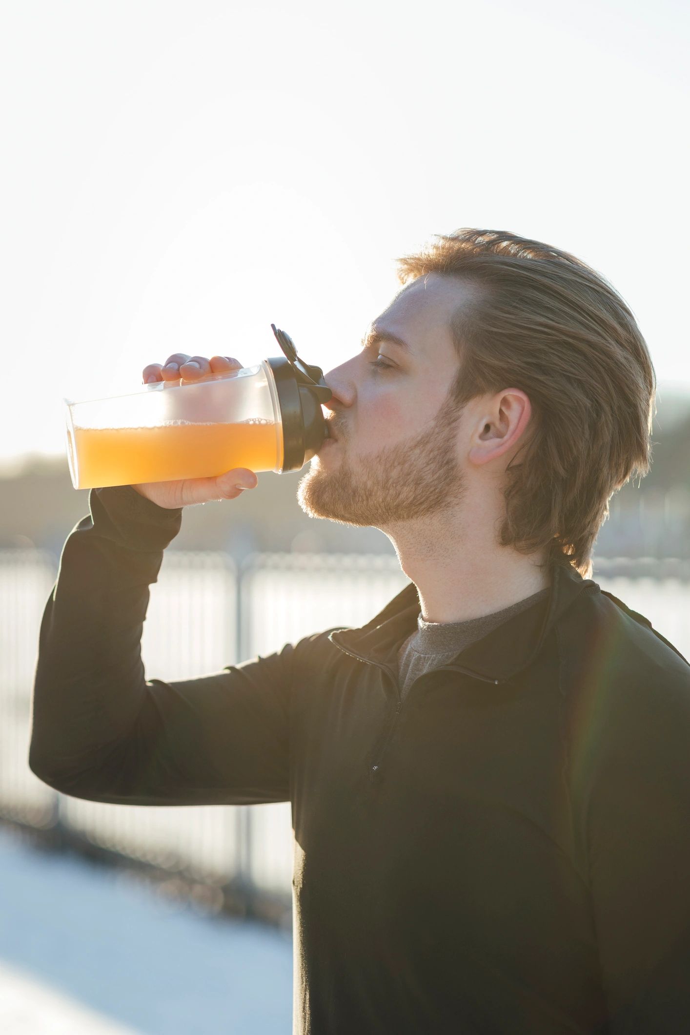 Active athlete hydrating after a run