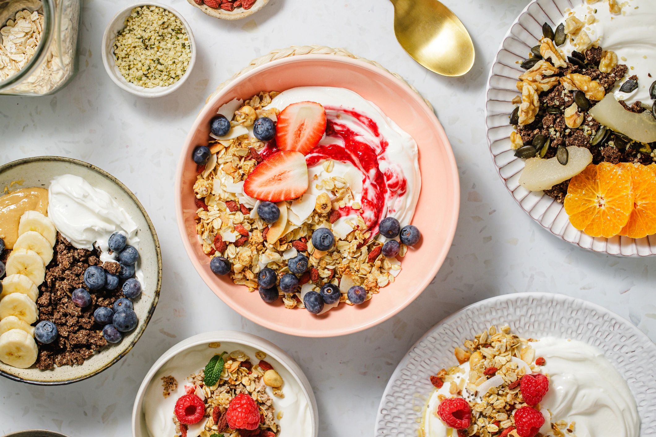 Wholesome breakfast bowls with fruit, granola, nuts, and seeds